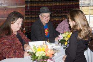 Shot of everyone signing books at Tom T's Hat Rack event
