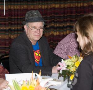 Tom at signing table at Tom T's Hat Rack event