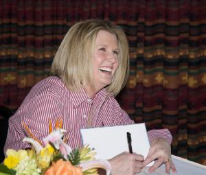 Big smile from Michele Spry at book signing for Tom T's Hat Rack