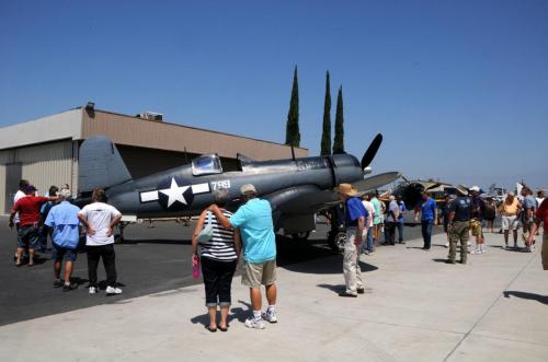 Planes of Fame - August 6, 2016 - guests looking at corsair
