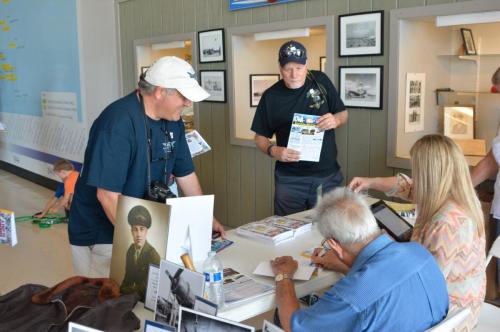 Planes of Fame - August 6, 2016 - guests gathered at book signing table